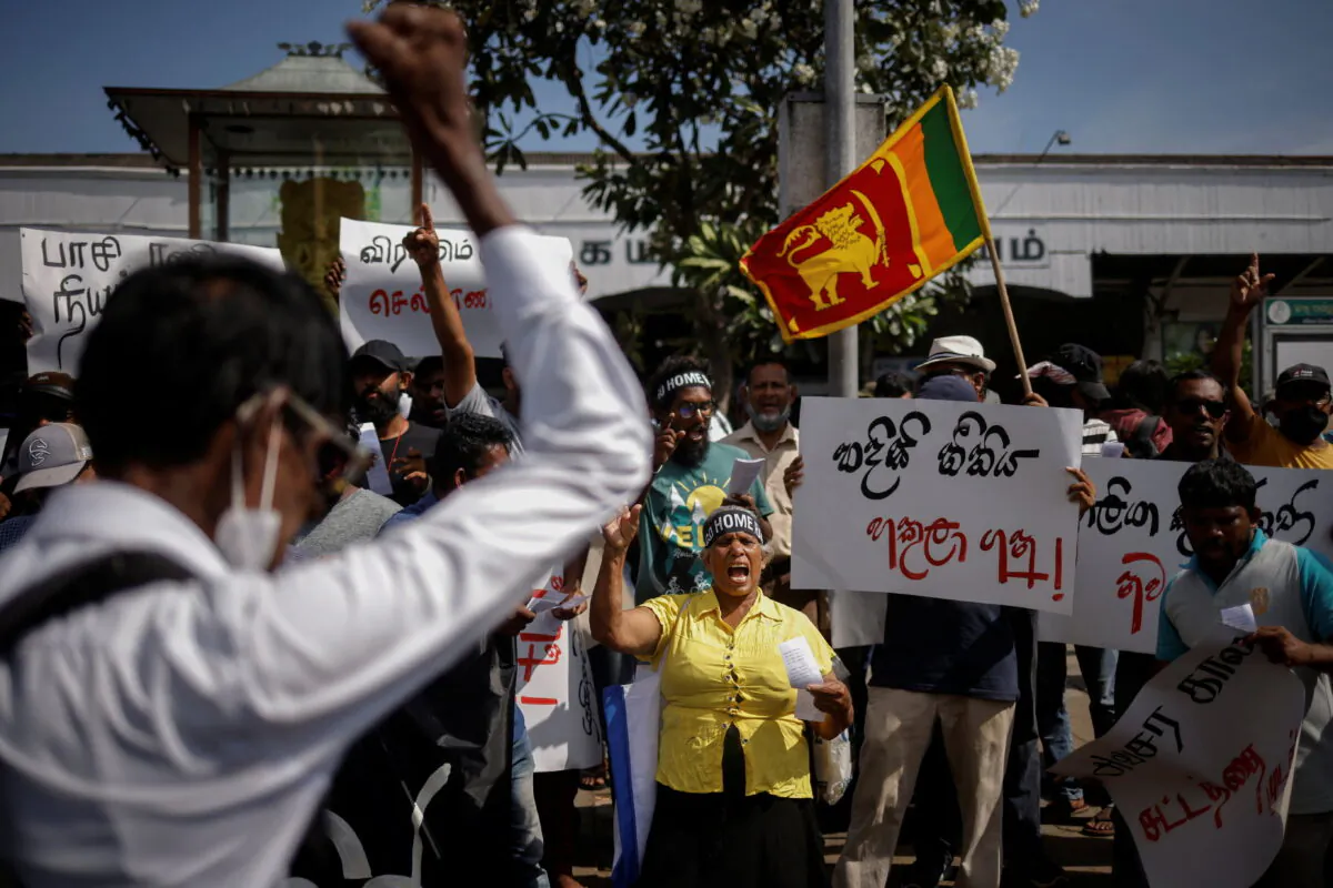 Protestors shout slogans during a protest demanding the resignation of Sri Lanka's acting President Ranil Wickremesinghe, in Colombo, Sri Lanka, on July 19, 2022. (Adnan Abidi/Reuters)