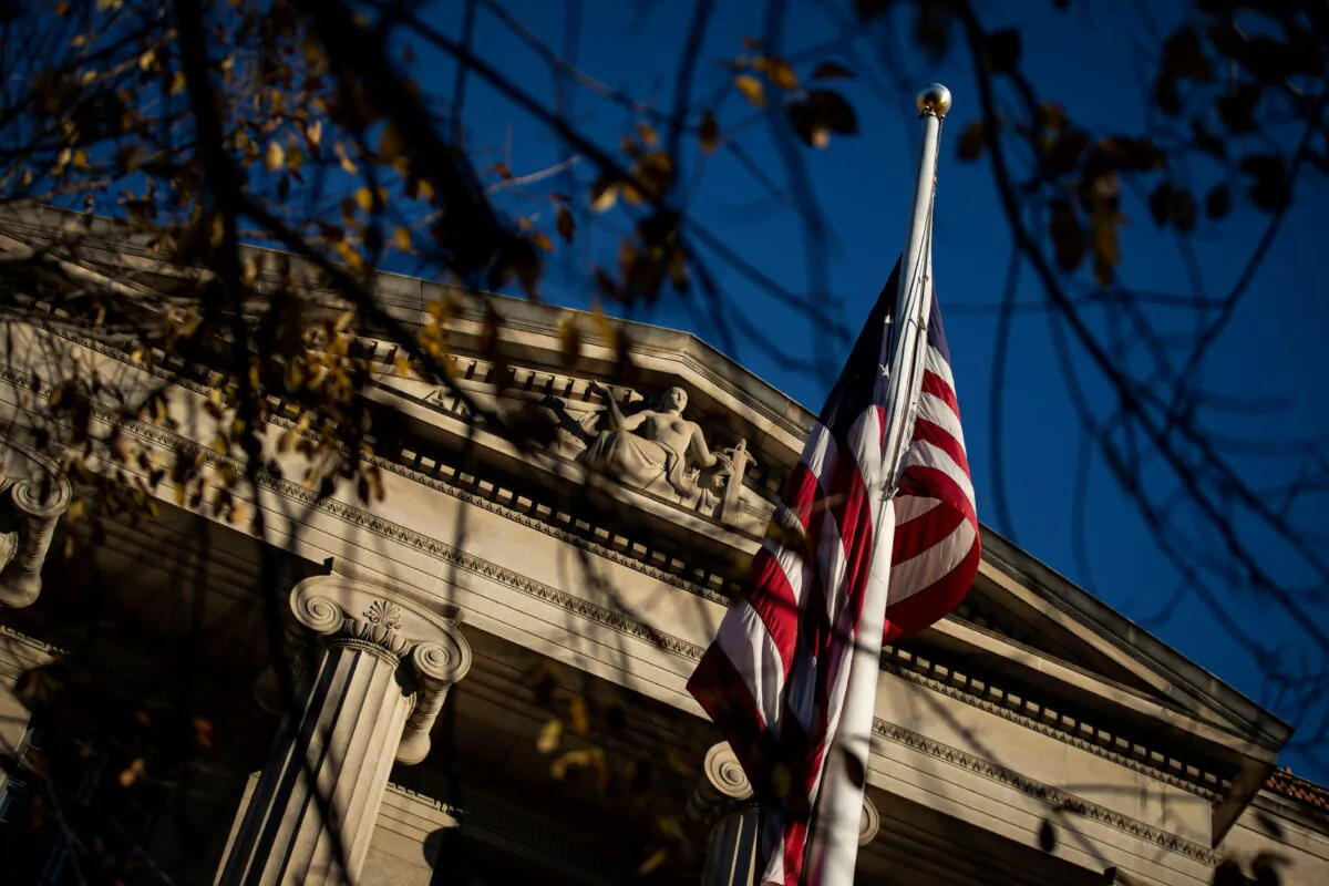 An American flag waves outside the U.S. Department of Justice Building in Washington, on Dec. 15, 2020. (Al Drago/Reuters)