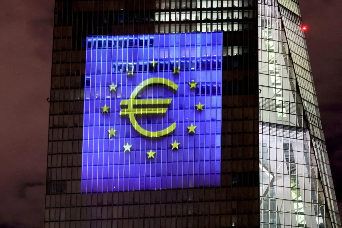 The colors of the European Union illuminate the south facade of the European Central Bank headquarters in Frankfurt, Germany, on Dec. 30, 2021. (Reuters/Wolfgang Rattay