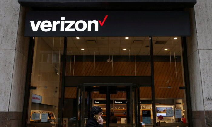 A person walks by a Verizon store in Manhattan, New York, on Nov. 22, 2021. (Andrew Kelly/Reuters)