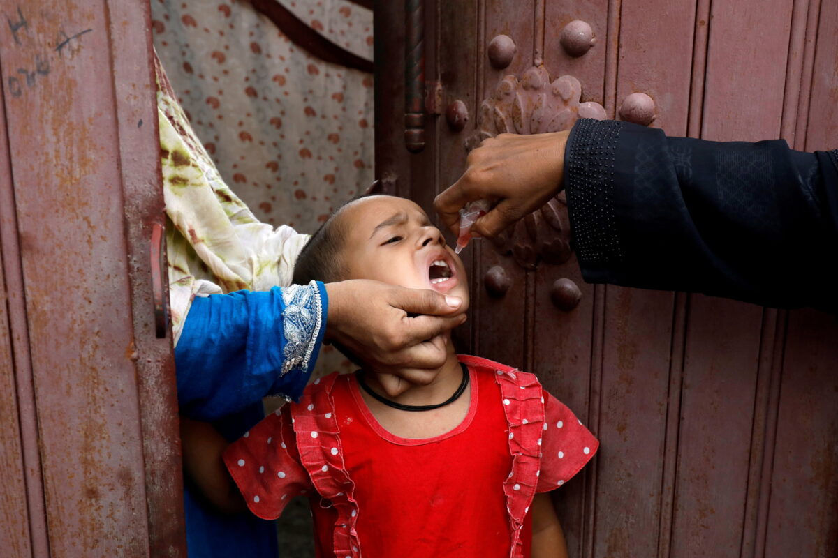 Girl receiving polio vaccine