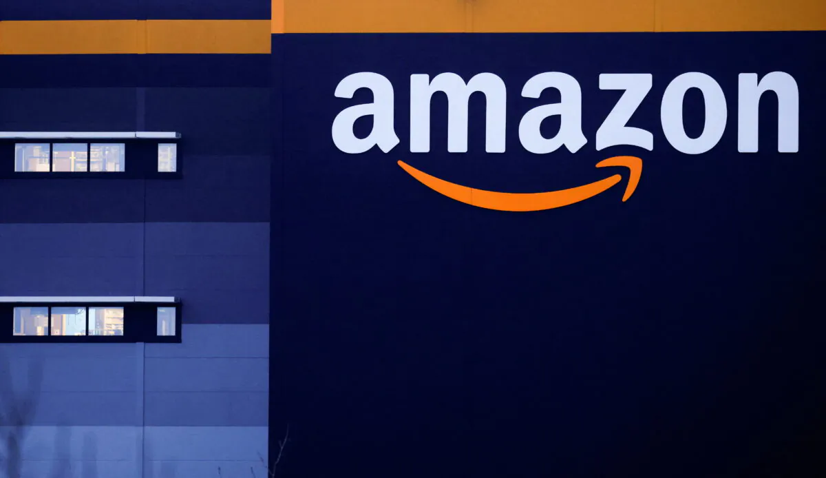 The logo of Amazon is seen at the company's logistics center in Bretigny-sur-Orge, near Paris, on Dec. 7, 2021. (Gonzalo Fuentes/Reuters)