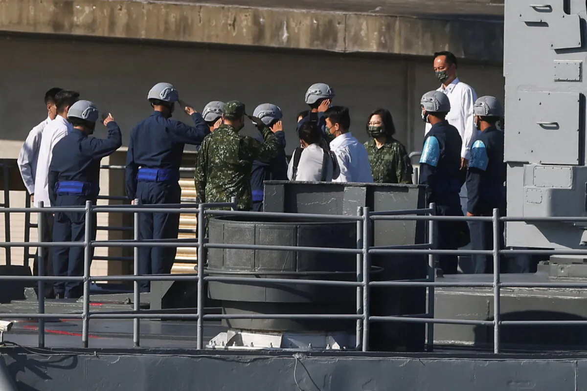 Taiwan's President Tsai Ing-wen walks on board a DDG-1801 as part of Taiwan's main annual "Han Kuang" exercises, as 20 naval vessels including frigates and destroyers fired shells to simulate intercepting and attacking an invading force, off Taiwan's northeastern coast, in Yilan, Taiwan, on July 26, 2022. (Ann Wang/Reuters)
