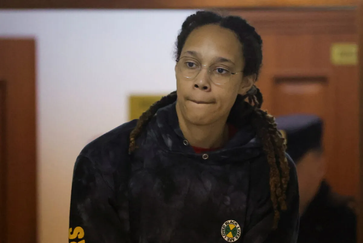 U.S. basketball player Brittney Griner, who was detained at Moscow's Sheremetyevo airport and later charged with illegal possession of cannabis, is escorted before a court hearing in Khimki outside Moscow on July 26, 2022. (Evgenia Novozhenina/Pool/Reuters)