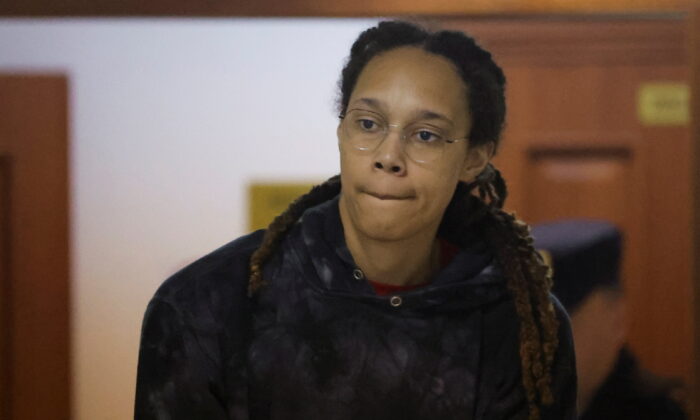U.S. basketball player Brittney Griner, who was detained at Moscow's Sheremetyevo airport and later charged with illegal possession of cannabis, is escorted before a court hearing in Khimki outside Moscow on July 26, 2022. (Evgenia Novozhenina/Pool/Reuters)
