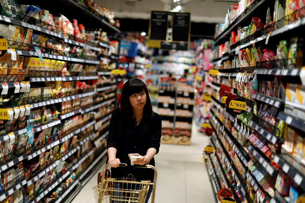 A customer inside the Gourmet Market supermarket in Bangkok, Thailand, on May 20, 2017. (Jorge Silva/Reuters)