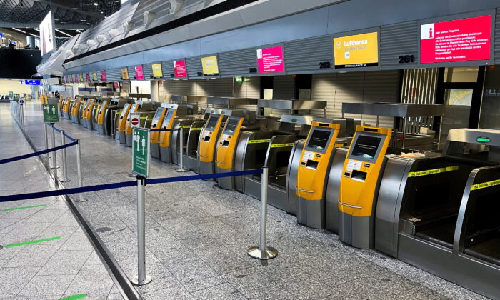 Empty counters of German airline Lufthansa at Frankfurt Airport during a strike of security staff at various German airports on March 15, 2022. (Timm Reichert/Reuters)