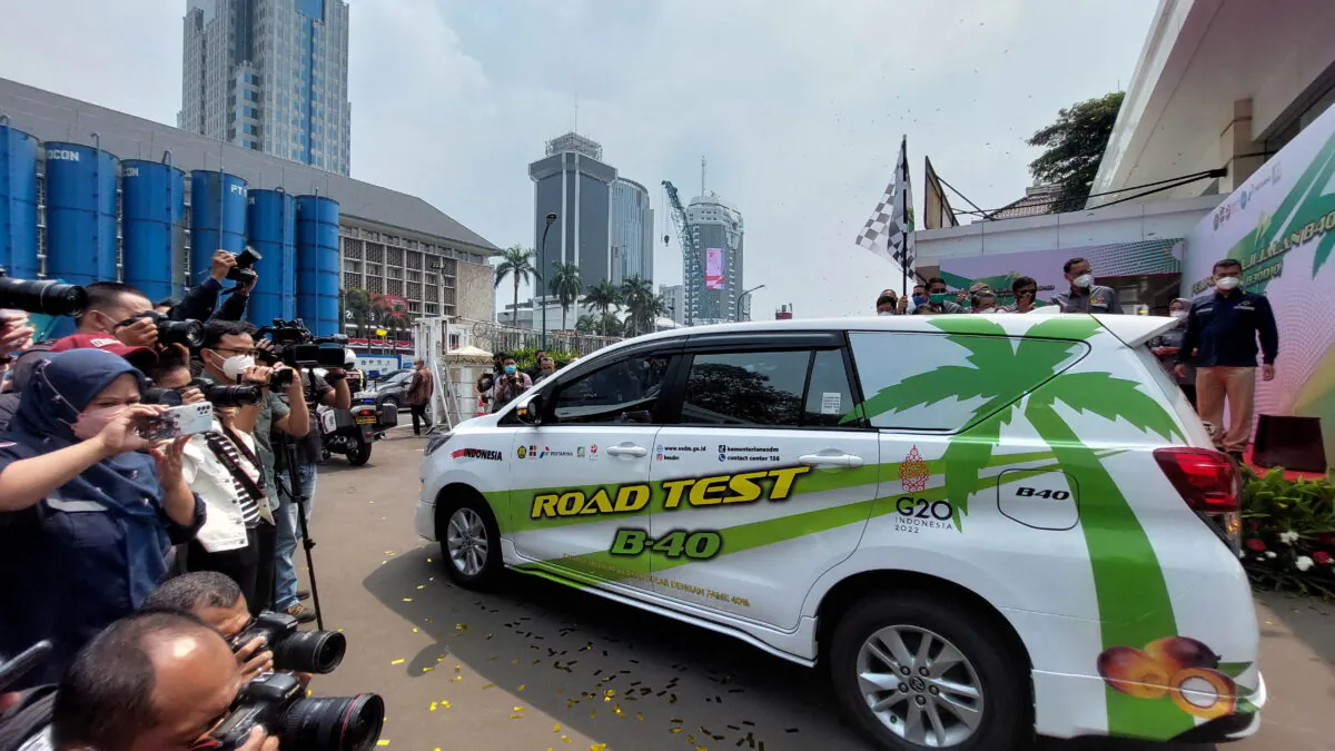 People take pictures of a car road test for fuel with 40 percent palm based biodiesel blending at a Ministry of Energy and Mineral Resources area in Jakarta, Indonesia on July 27, 2022. (Bernadette Christina Munthe/Reuters)