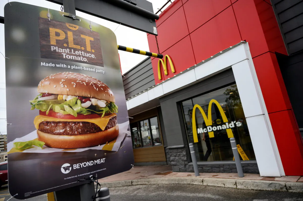 FILE PHOTO: A sign promoting McDonald's "PLT" burger with a Beyond Meat plant-based patty at one of 28 test restaurant locations in Ontario, Canada, October 2, 2019. REUTERS/Moe Doiron