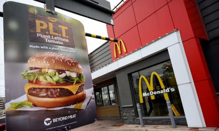 FILE PHOTO: A sign promoting McDonald's "PLT" burger with a Beyond Meat plant-based patty at one of 28 test restaurant locations in Ontario, Canada, October 2, 2019. REUTERS/Moe Doiron