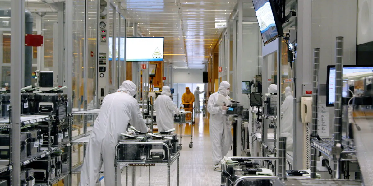 Employees work inside the clean room of semiconductor manufacturer SkyWater Technology in Bloomington, Minnesota, in April 2022. (SkyWater Technology/Reuters)