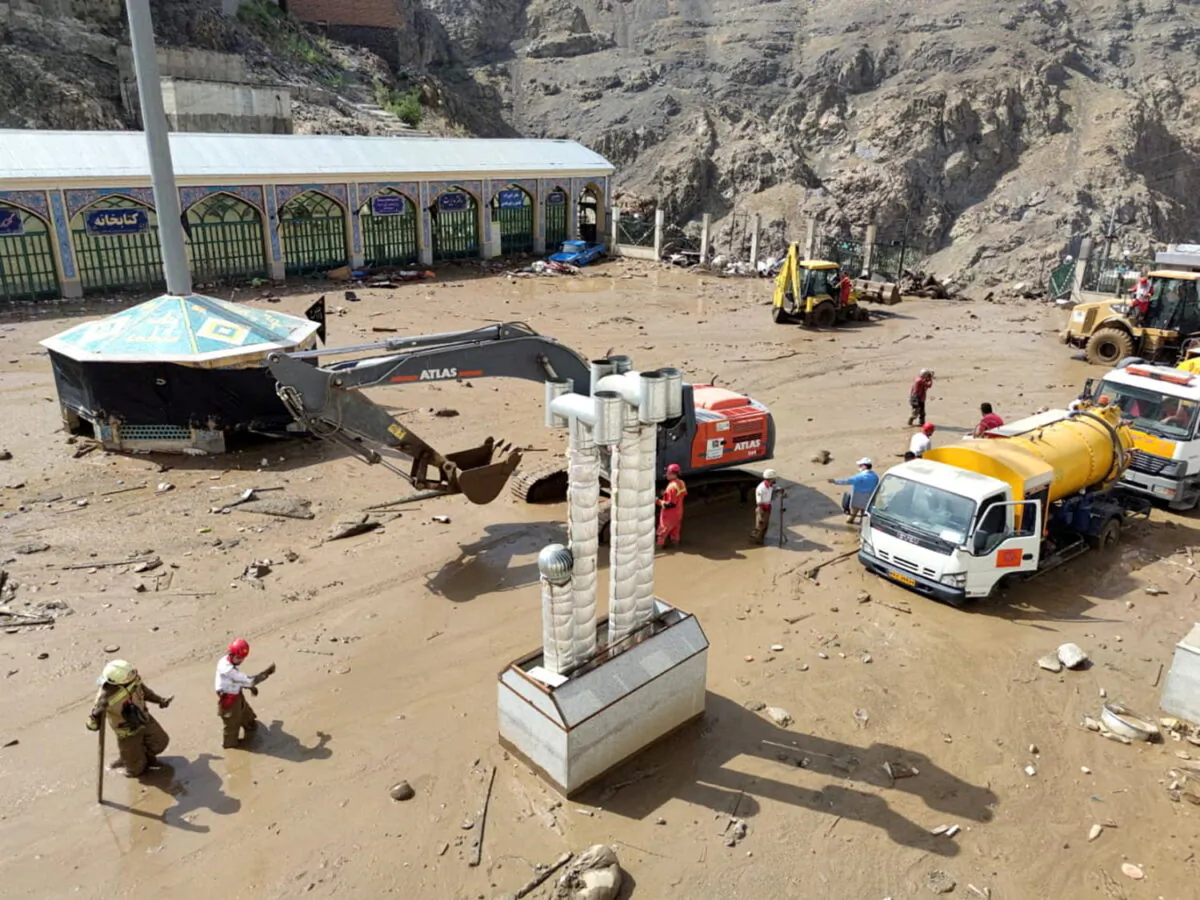 Rescuers work following the flood in Imamzadeh Davoud village in the north of Tehran, Iran, on July 28, 2022. (Iranian Red Crescent Society/WANA (West Asia News Agency)/Handout via Reuters)