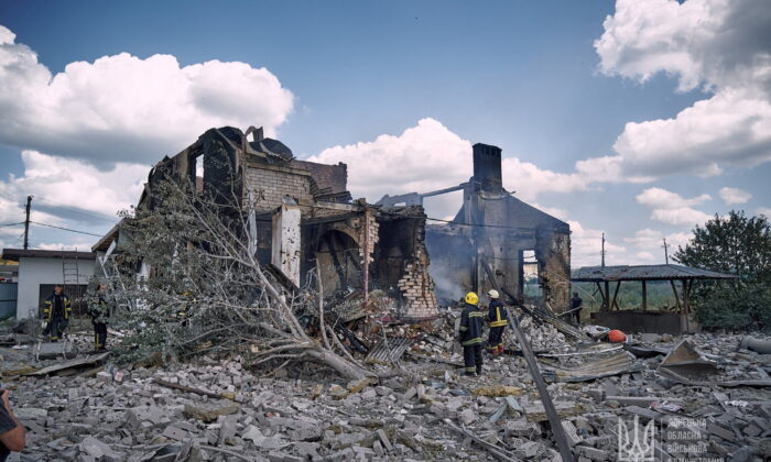 Firefighters work at the site of a destroyed building in Kramatorsk, Ukraine, on July 29, 2022. (Press service of the Donetsk Regional Military Administration/Handout via Reuters)