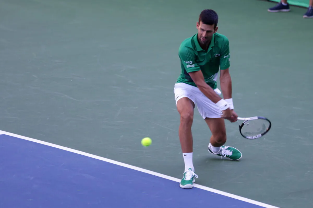 Serbian tennis player Novak Djokovic performs during the opening of a regional tennis center that will prepare top tennis players for major tournaments, in Visoko, Bosnia and Herzegovina, on July 13, 2022. (Dado Ruvic/Reuters)