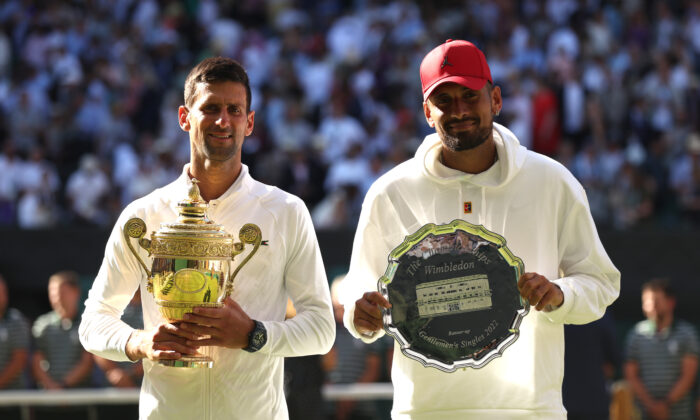 Winner Novak Djokovic of Serbia (L) and runner up Nick Kyrgios of Australia pose for a photo with their trophies following their Men's Singles Final match on day 14 of The Championships Wimbledon 2022 at All England Lawn Tennis and Croquet Club in London on July 10, 2022. (Julian Finney/Getty Images)