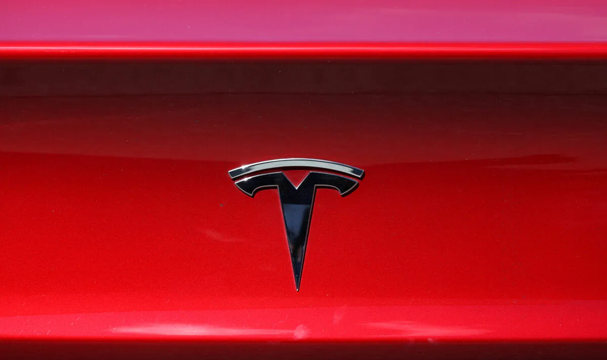 The Tesla logo is displayed on a Tesla car in Corte Madera, Calif., on April 26, 2021. (Justin Sullivan/Getty Images)