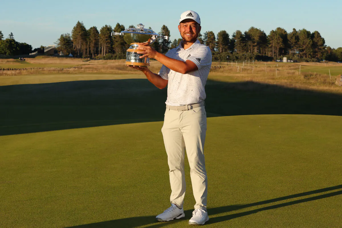 Xander Schauffele of the United States poses with the trophy after winning the Genesis Scottish Open at The Renaissance Club in North Berwick, Scotland, on July 10, 2022. (Kevin C. Cox/Getty Images)