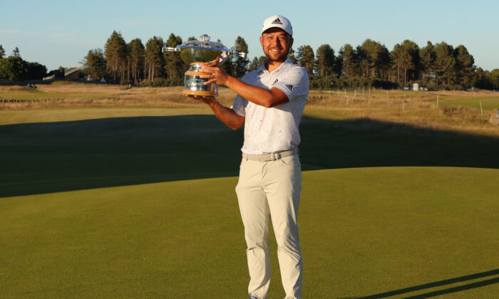 Xander Schauffele of the United States poses with the trophy after winning the Genesis Scottish Open at The Renaissance Club in North Berwick, Scotland, on July 10, 2022. (Kevin C. Cox/Getty Images)