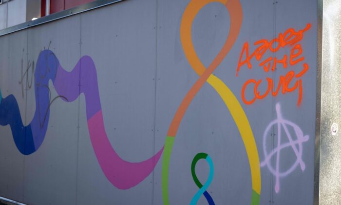 Spray-painted messages are seen at Mother and Child Education Center in Portland, Oregon, on June 26, 2022, after the property was vandalized by demonstrators the night of June 25, 2022. (John Rudoff/AFP via Getty Images)
