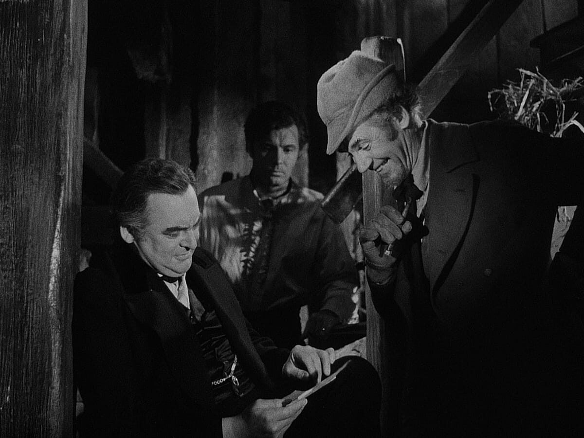 (L–R) Edward Arnold as Daniel Webster, James Craig as Jabez Stone, and Walter Huston as the devil in a scene from 1941's "The Devil and Daniel Webster." (RKO Radio Pictures)
