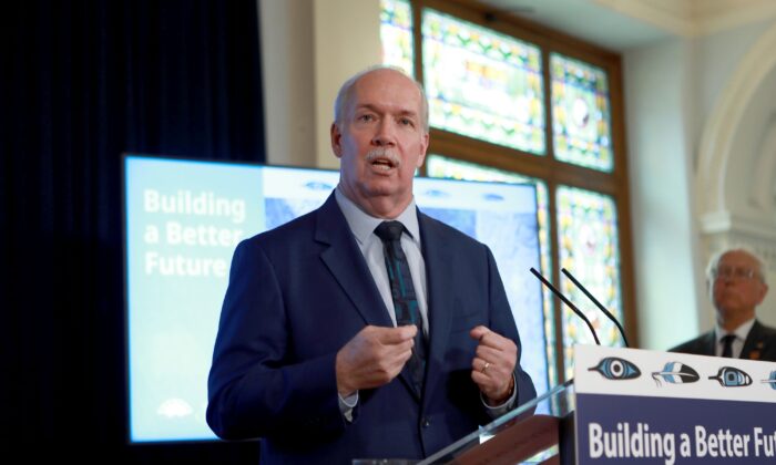 B.C. Premier John Horgan speaks during a ceremony at the legislature in Victoria on March 30, 2022. As chair of the Council of the Federation, Horgan is hosting the 2022 premiers' meeting on July 11 and 12 at the Fairmont Empress in Victoria. (The Canadian Press/Chad Hipolito)