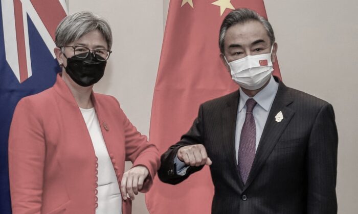 Australia's Foreign Minister Penny Wong (L) bumps elbows with China's Foreign Minister Wang Yi during their bilateral meeting on the sidelines of G20 Foreign Ministers Meeting in Nusa Dua on Indonesia's resort island of Bali on July 8, 2022. (Johannes P. Christo/POOL/AFP via Getty Images)