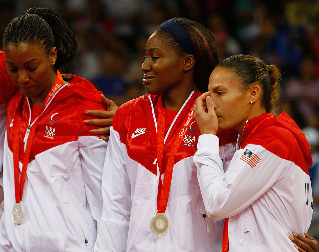 Kim Glass (C) and Robyn Ah Mow-Santos (L) console each other on the podium with their silver medals in Beijing, China, on Aug. 23, 2008. (Cameron Spencer/Getty Images)