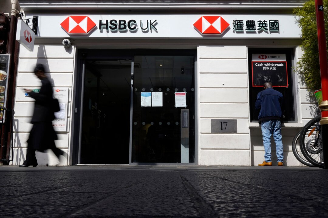 A pedestrian walks past a branch of a HSBC bank in central London on April 26, 2022. (Niklas Halle'n/AFP via Getty Images)