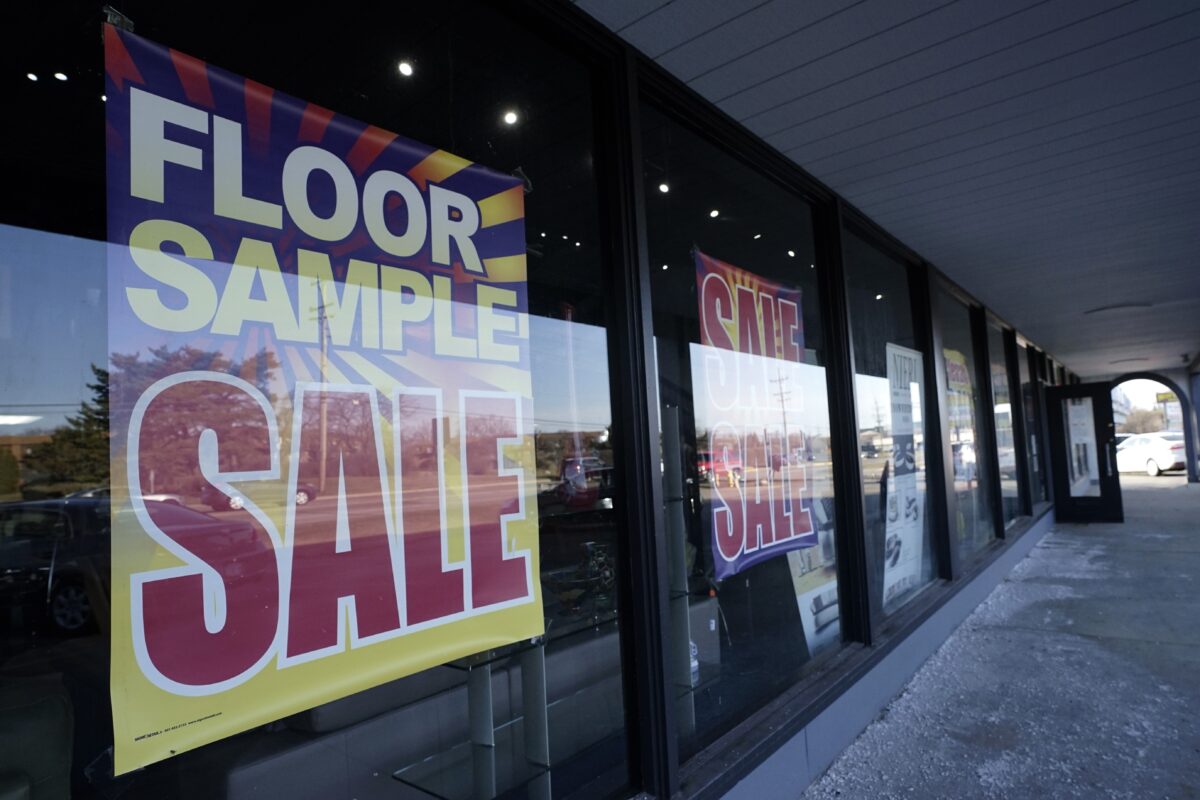 Sale signs are displayed at a home decor store in Northbrook, Ill., on March 13, 2021. (Nam Y. Huh/AP Photo)
