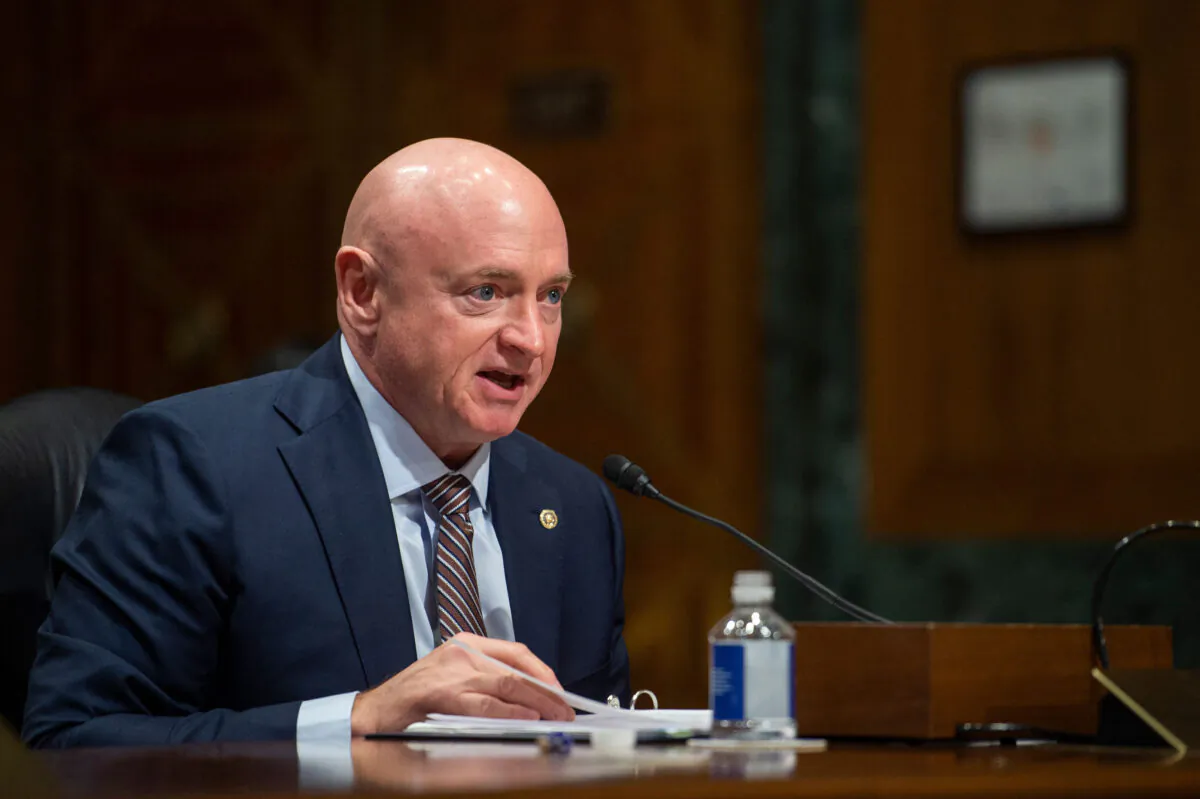 Sen. Mark Kelly (D-Ariz.) speaks during the Senate Finance Committee hearing on the nomination of Chris Magnus to be the next U.S. Customs and Border Protection Commissioner, on Capitol Hill in Washington on Oct. 19, 2021. (Rod Lamkey/Pool/AFP via Getty Images)