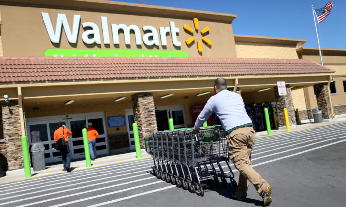 A Walmart employee pushes grocery carts at a store in Miami, Fla., on Feb. 19, 2015. (Joe Raedle/Getty Images)