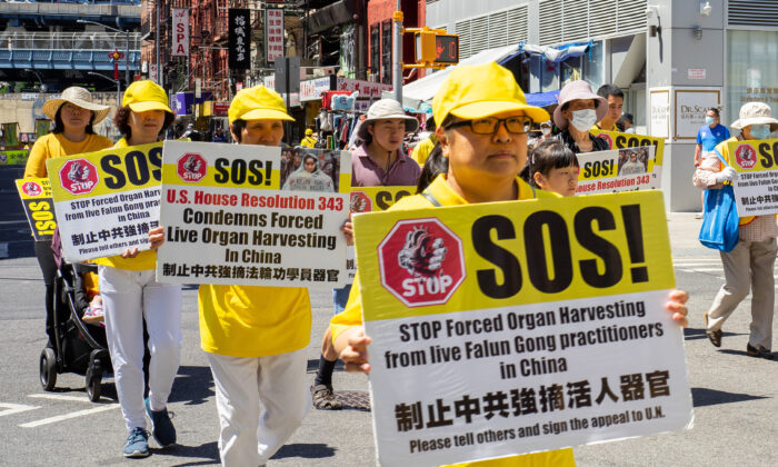 Falun Gong practitioners take part in a parade to commemorate the 23rd anniversary of the persecution of the spiritual discipline in China, in New York's Chinatown on July 10, 2022. (Chung I Ho/The Epoch Times)