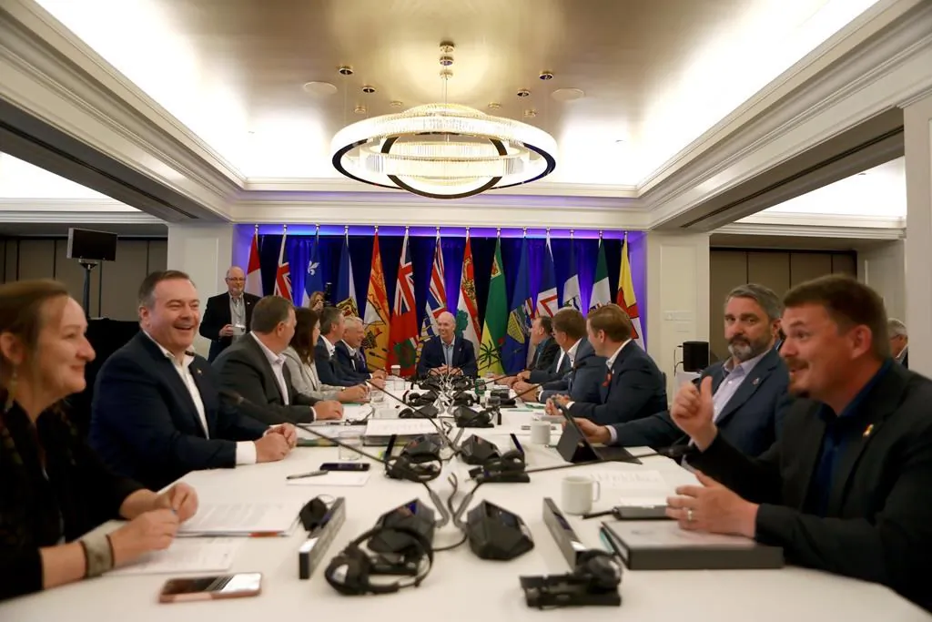 Premiers mingle during a photo op while at the summer meeting of the Canada's Premiers at the Fairmont Empress in Victoria, on July 11, 2022. (The Canadian Press/Chad Hipolito)