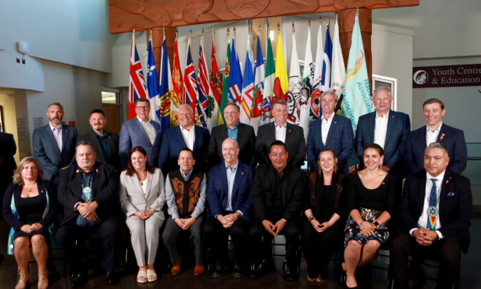 Premiers (back row L-R), Sandy Silver (Yukon), P.J. Akeeagok, (Nunavut), Scott Moe (SK), Doug Ford (Ont),Francois Legault (Que), Dennis King (PEI), Tim Houston (NS), Blaine Higgs (NB), Andrew Furey (NL and Labrador) and (front row L-R), President of Institute for the advancement of Aboriginal Women Lisa Weber, National Chief of Congress of Aboriginal Peoples Elmer St. Pierre,  Heather Stefanson (MB), Songhees Nation Chief Ron Sam, John Horgan (BC), Esquimalt Nation Chief Rob Thomas, Caroline Cochrane (NWT), Cassidy Caron (Metis National Council) and Terry Teegee (Assembly of First Nations) gather for a family photo during the summer meeting of the Canada's Premiers at the Songhees Wellness Centre in Victoria, B.C., on July 11, 2022. (The Canadian Press/Chad Hipolito)