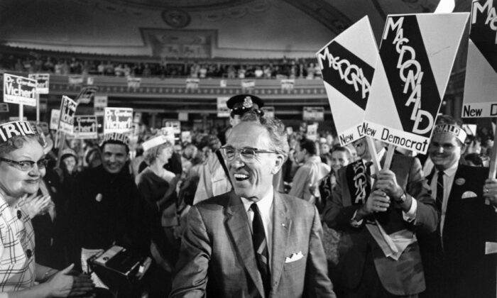 Tommy Douglas, known as the father of Medicare, receives a standing ovation while arriving at the Palace Theatre to address an NDP rally in Hamilton, Ont., on June 11, 1968. (The Canadian Press)