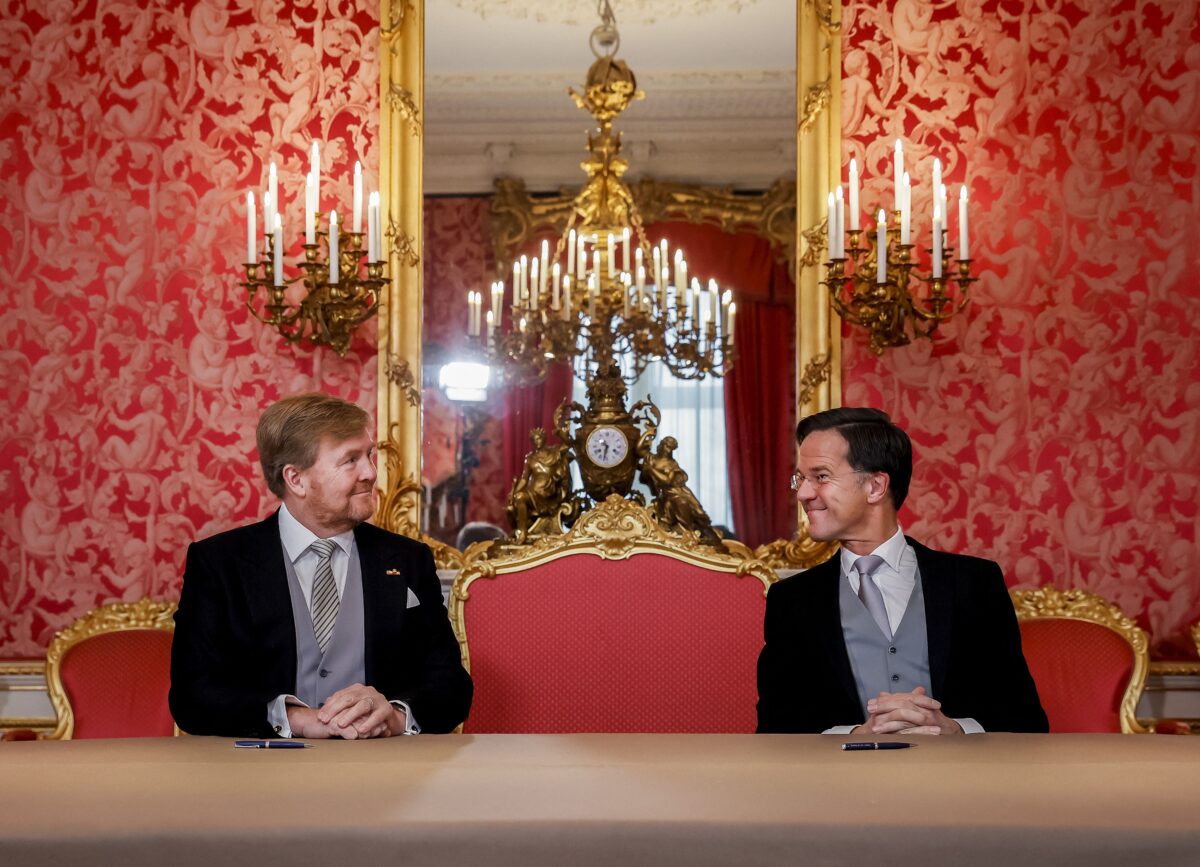 King Willem-Alexander and Prime Minister Mark Rutte sign the Royal Decrees, as part of the inauguration of the new Mark Rutte's IV cabinet, at Noordeinde Palace in The Hague, on January 10, 2022. - Dutch Prime Minister Mark Rutte's fourth successive coalition government is to be sworn in, marking the end of the longest running formation of 271 days in Dutch history. - Netherlands OUT (Photo by Sem VAN DER WAL / various sources / AFP) / Netherlands OUT (Photo by SEM VAN DER WAL/POOL/AFP via Getty Images)