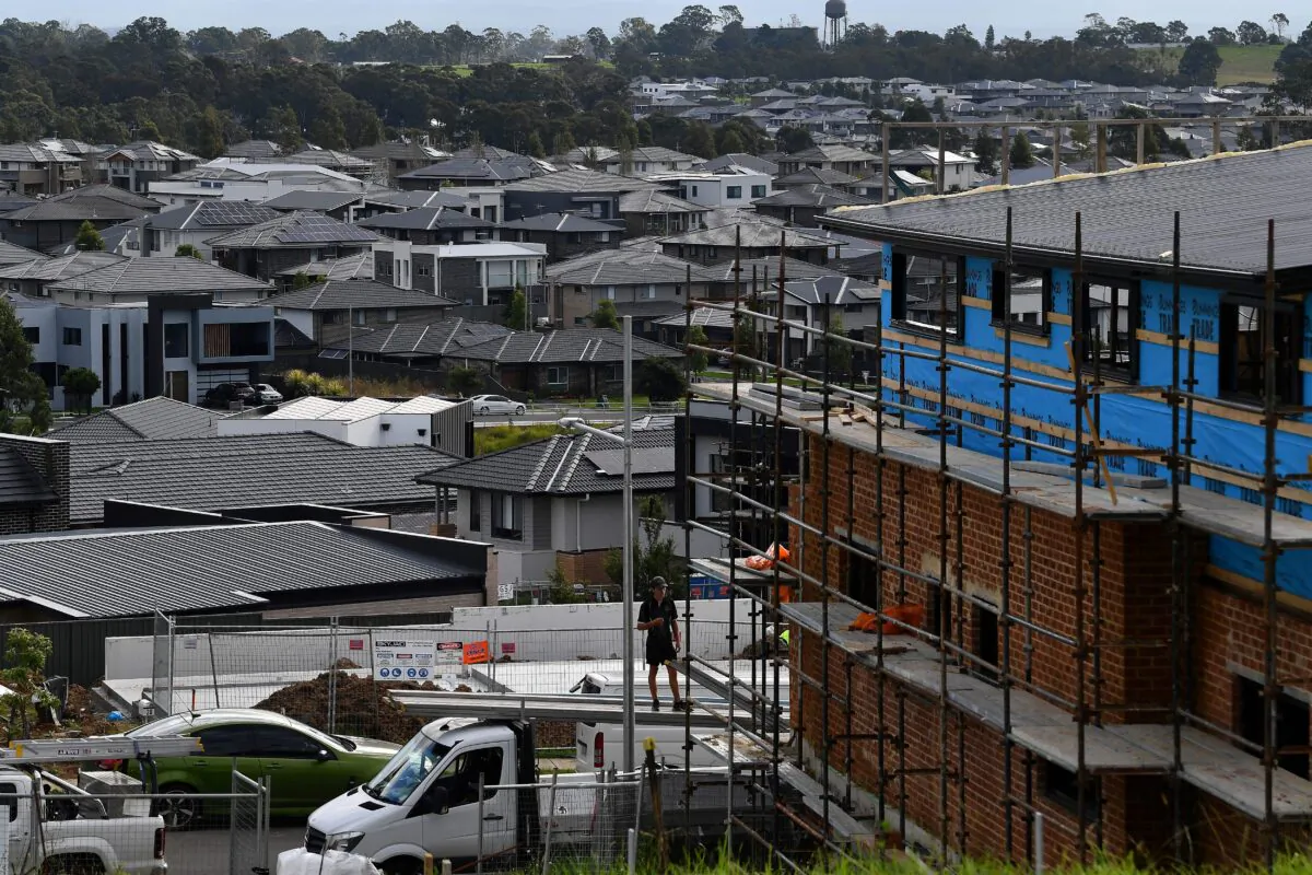 A labourer works on an under construction house in the western Sydney, Australia, on May 4, 2022. (Saeed Khan/AFP via Getty Images)