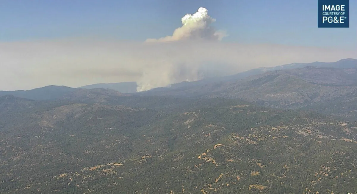 Smoke rises from hills as the Washburn Fire burns near Ahwahnee, Calif., on July 9, 2022, in this screengrab taken from a video. (alertwildfire.org/Handout via Reuters)