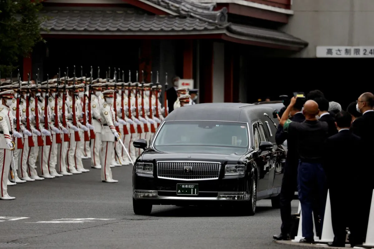 A vehicle carrying the body of the late former Japanese Prime Minister Shinzo Abe leaves after his funeral at Zojoji Temple in Tokyo, Japan, on July 12, 2022. (Issei Kato/Reuters)