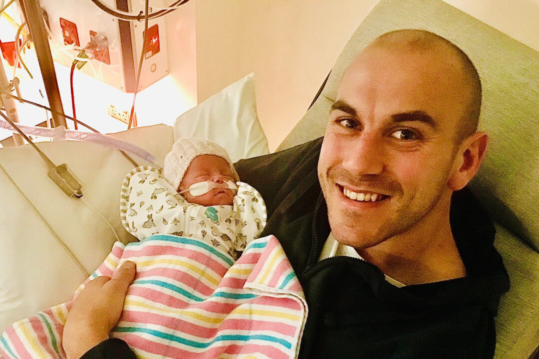 Joel Mackenzie in the NICU at the Women's and Children's Hospital in Adelaide, bonding with his tiny preterm daughter, Lucy. (University of South Australia)