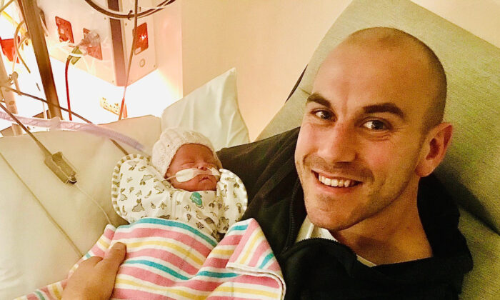 Joel Mackenzie in the NICU at the Women's and Children's Hospital in Adelaide, bonding with his tiny preterm daughter, Lucy. (University of South Australia)