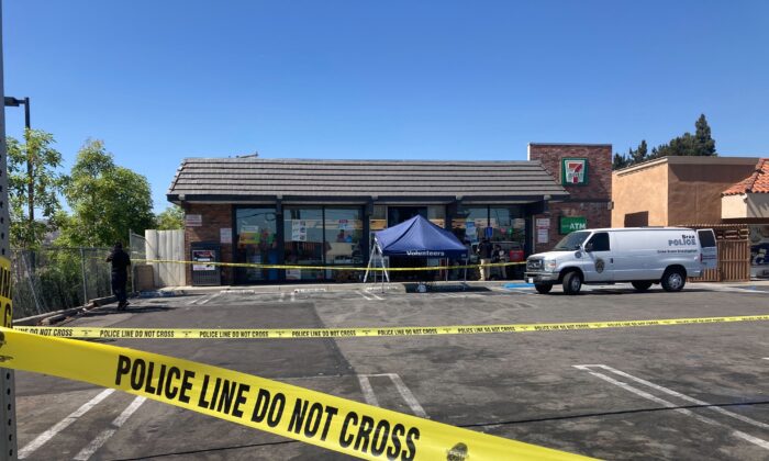 Police crime scene tape closes off a parking area following a shooting at a 7 Eleven store in Brea, Calif., on July 11, 2022. (Eugene Garcia/AP Photo)