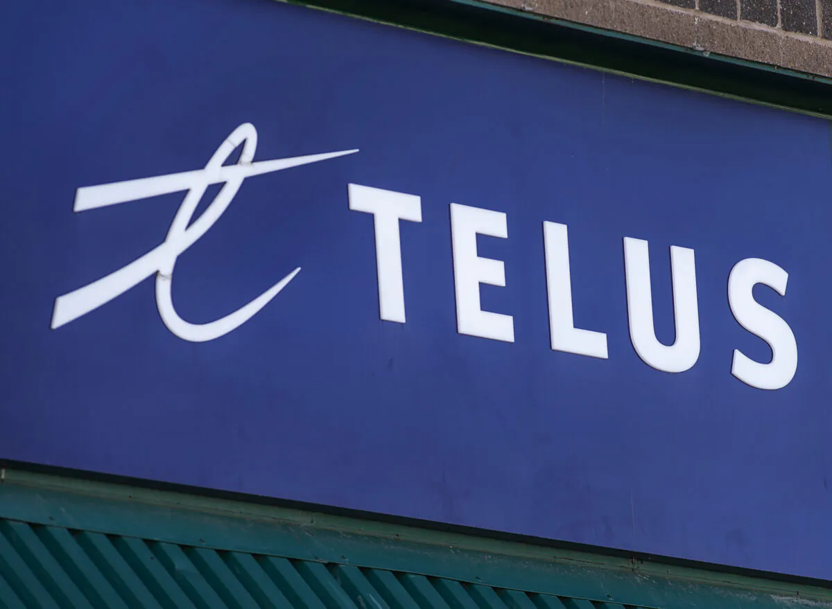 A Telus sign is seen on a storefront in Halifax on Feb. 11, 2021. (The Canadian Press/Andrew Vaughan)