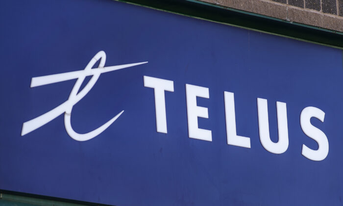 A Telus sign is seen on a storefront in Halifax on Feb. 11, 2021. (The Canadian Press/Andrew Vaughan)