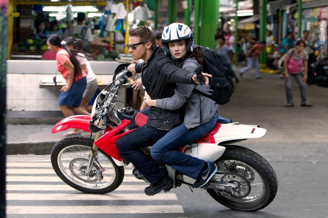 man and woman on motorcycle in The Bourne Legacy