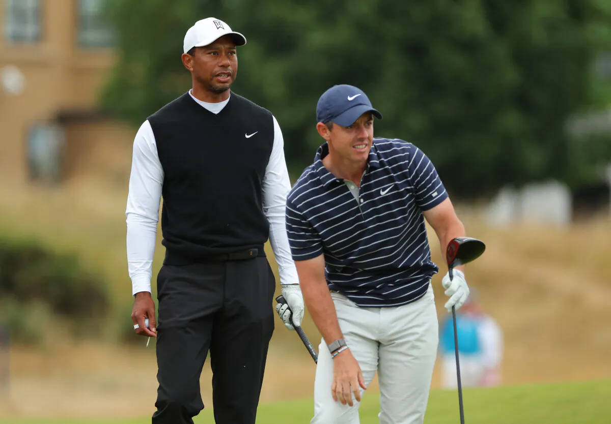Tiger Woods of The United States and Rory McIlroy of Northern Ireland interact on the 18th during the Celebration of Champions Challenge during a practice round prior to The 150th Open at St Andrews Old Course in St Andrews, Scotland, on July 11, 2022. (Kevin C. Cox/Getty Images)