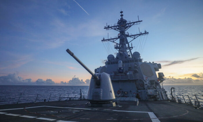 Arleigh Burke-class guided-missile destroyer USS Benfold (DDG 65), forward-deployed to the U.S. 7th Fleet area of operations, conducts underway operations in the South China Sea on July 13, 2022. (U.S. Navy/Handout via Reuters)