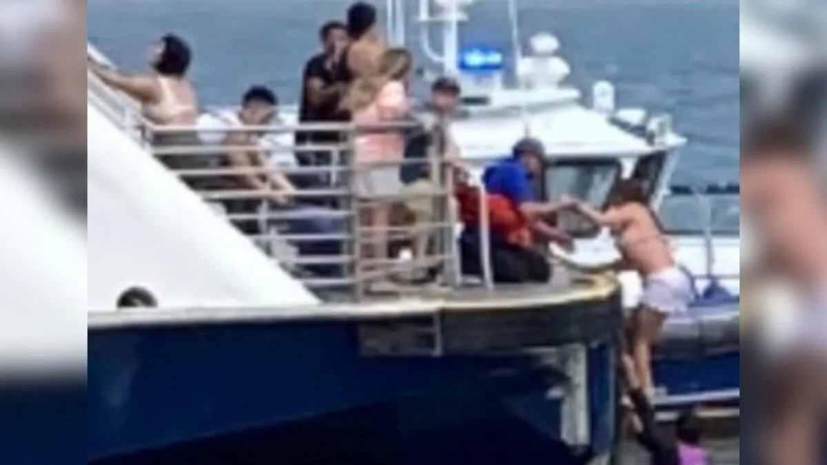Ferry personnel making rescue of individuals after a boat capsized in the Hudson River in New York on July 12, 2022. (NY Waterway via AP)