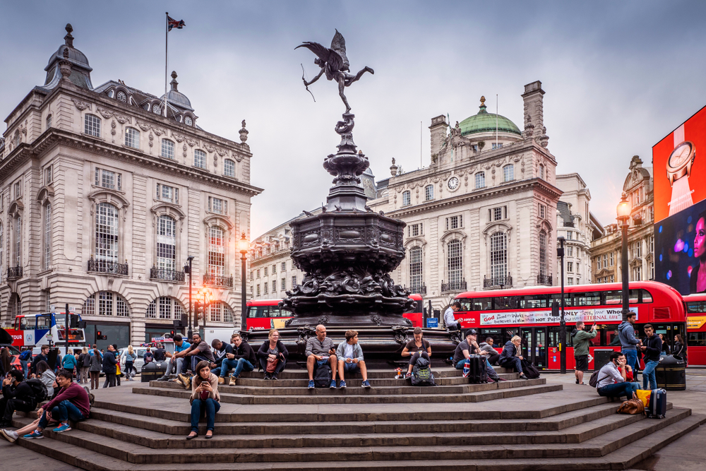 Locals and tourists tarry in Picadilly Circus. (Marcio Jose Bastos Silva/Shutterstock)