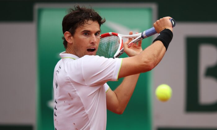 Dominic Thiem of Austria plays a backhand during his mens singles first round against Hugo Dellien of Bolivia on day 1 of the 2022 French Open at Roland Garros in Paris on May 22, 2022. (Adam Pretty/Getty Images)